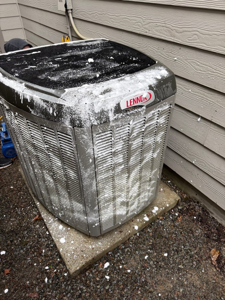 Clean Lennox heat pump outdoor unit