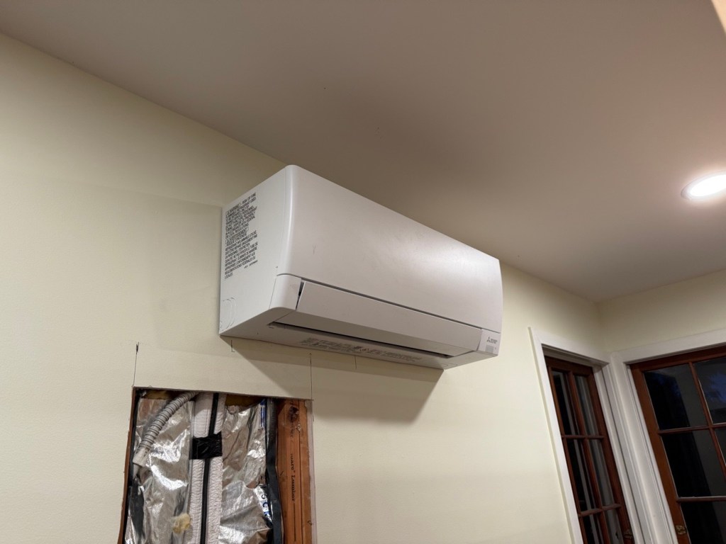 Daikin outdoor mini-split unit on wall bracket