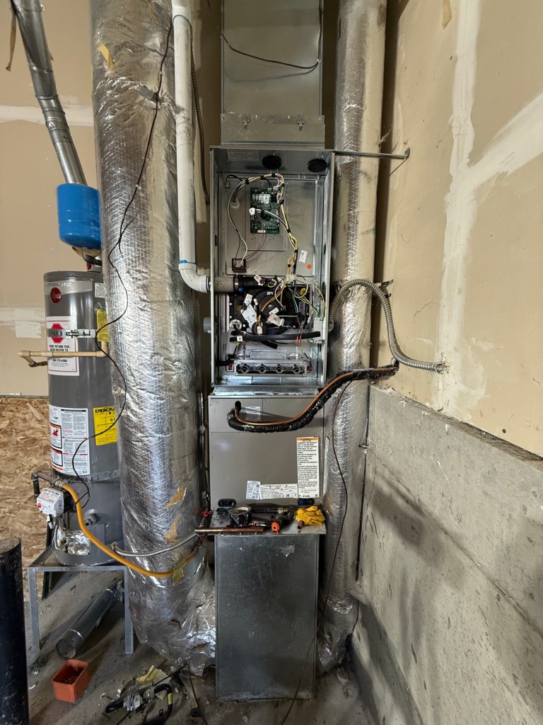 Open furnace during installation with front panel removed